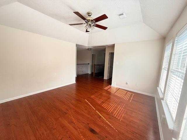 9619 Therrell Dr, Houston, TX 77064 - unfurnished room with lofted ceiling, a ceiling fan, wood finished floors, baseboards, and a textured ceiling