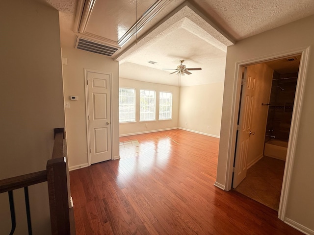 9619 Therrell Dr, Houston, TX 77064 - spare room with ceiling fan, wood finished floors, a textured ceiling, and baseboards