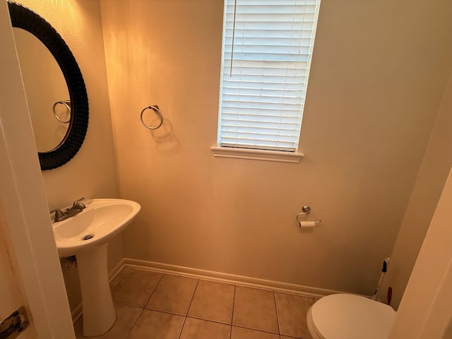 9619 Therrell Dr, Houston, TX 77064 - bathroom with baseboards, tile patterned flooring, and toilet