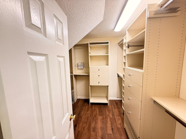 9619 Therrell Dr, Houston, TX 77064 - spacious closet featuring dark wood-style flooring