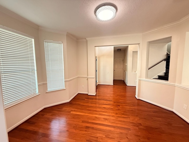 9619 Therrell Dr, Houston, TX 77064 - unfurnished room with wood finished floors, baseboards, ornamental molding, stairway, and plenty of natural light