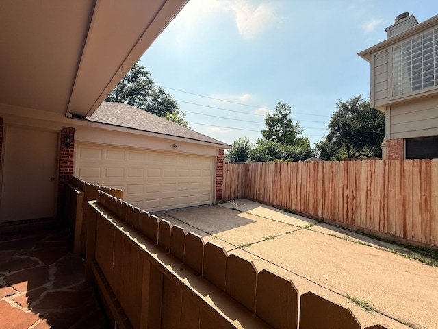 9619 Therrell Dr, Houston, TX 77064 - view of patio / terrace with a garage
