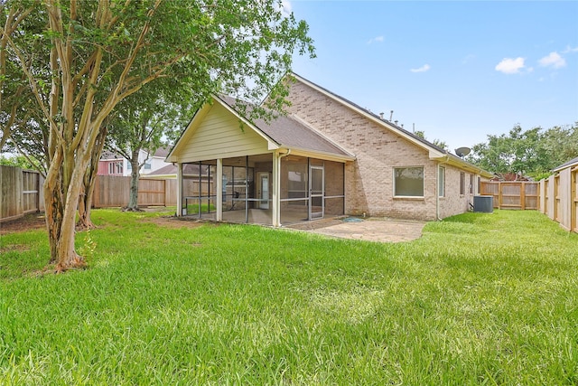 4907 Sundance Hollow Ln, Katy, TX 77494 - back of property with a sunroom and a fenced backyard