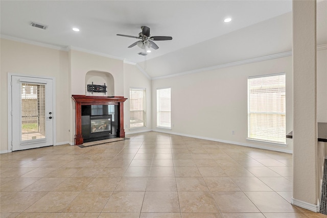 4907 Sundance Hollow Ln, Katy, TX 77494 - unfurnished living room featuring crown molding, a tiled fireplace, a ceiling fan, lofted ceiling, and light tile patterned flooring