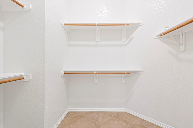 4907 Sundance Hollow Ln, Katy, TX 77494 - spacious closet featuring light tile patterned flooring