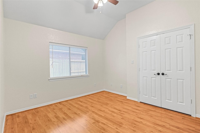 4907 Sundance Hollow Ln, Katy, TX 77494 - unfurnished bedroom featuring lofted ceiling, light wood-style flooring, a closet, and a ceiling fan