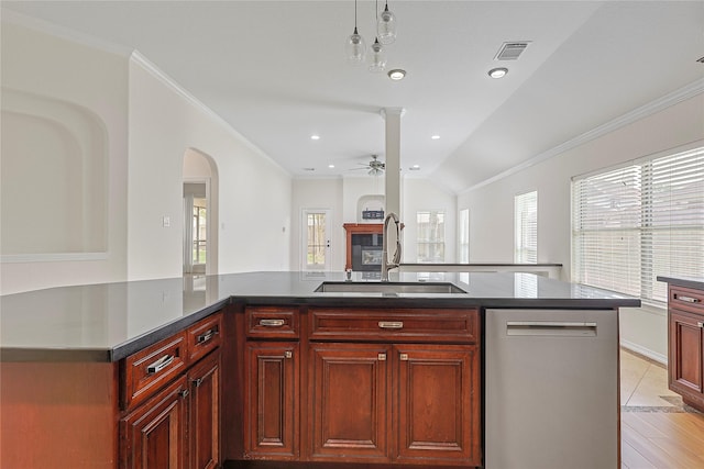 4907 Sundance Hollow Ln, Katy, TX 77494 - kitchen featuring dishwasher, reddish brown cabinets, ceiling fan, vaulted ceiling, and crown molding
