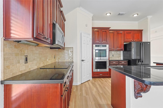 4907 Sundance Hollow Ln, Katy, TX 77494 - kitchen featuring dark brown cabinets, appliances with stainless steel finishes, crown molding, light wood-type flooring, and tasteful backsplash