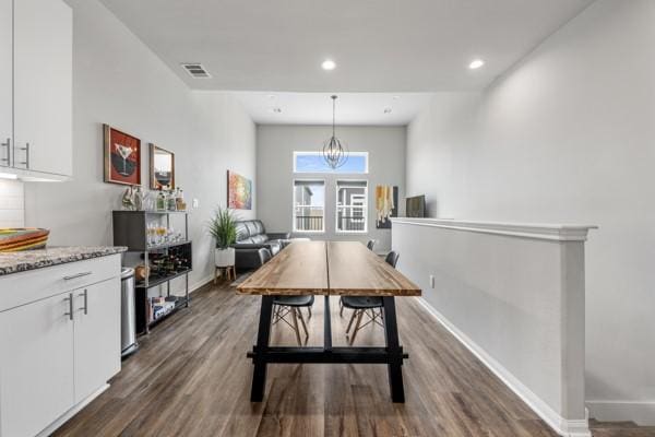 4908 Paradigm Ln, Spring, TX 77379 - dining area featuring dark wood finished floors, baseboards, recessed lighting, and a chandelier
