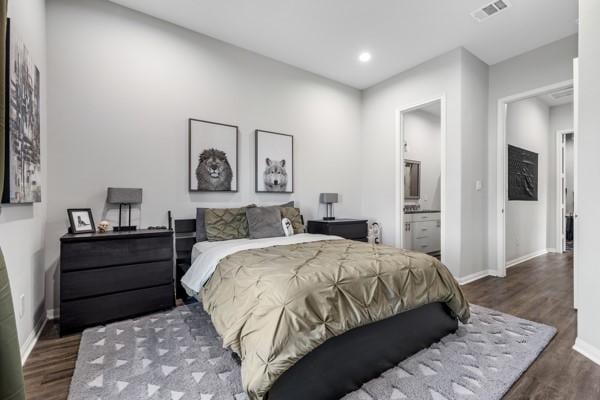 4908 Paradigm Ln, Spring, TX 77379 - bedroom featuring wood finished floors, baseboards, recessed lighting, and ensuite bathroom