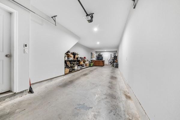4908 Paradigm Ln, Spring, TX 77379 - garage with recessed lighting and a garage door opener