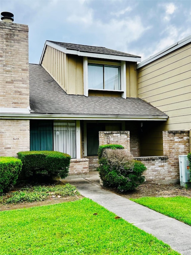 6128 Dryad Dr, Houston, TX 77035 - multi unit property featuring brick siding, a chimney, and a front lawn