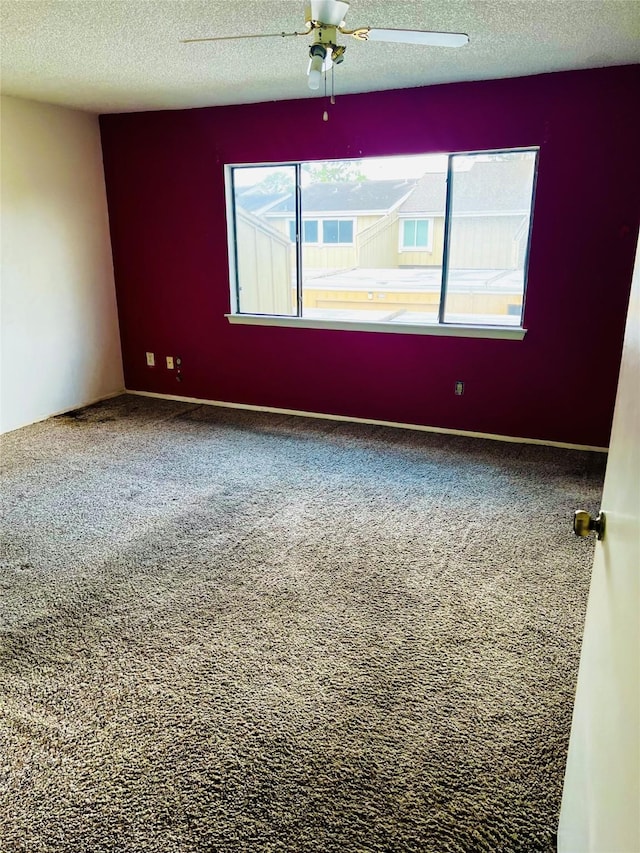 6128 Dryad Dr, Houston, TX 77035 - carpeted spare room with a textured ceiling and a ceiling fan