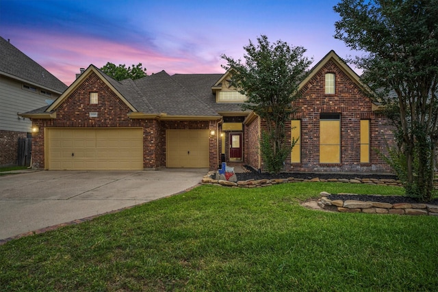 19918 Cypresswood Lake Dr, Spring, TX 77373 - view of front facade featuring an attached garage, driveway, a yard, brick siding, and a shingled roof