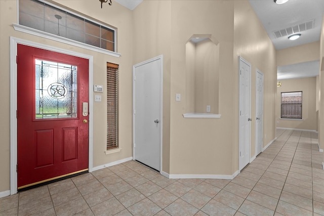 19918 Cypresswood Lake Dr, Spring, TX 77373 - foyer with light tile patterned floors, baseboards, and a towering ceiling
