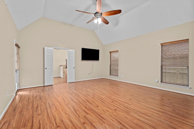 19918 Cypresswood Lake Dr, Spring, TX 77373 - unfurnished living room featuring ceiling fan, light wood finished floors, lofted ceiling, and baseboards