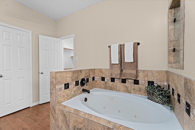 19918 Cypresswood Lake Dr, Spring, TX 77373 - full bath featuring a whirlpool tub and wood finished floors