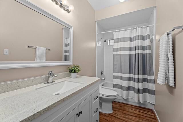 19918 Cypresswood Lake Dr, Spring, TX 77373 - bathroom with vanity, toilet, wood finished floors, and shower / tub combo with curtain
