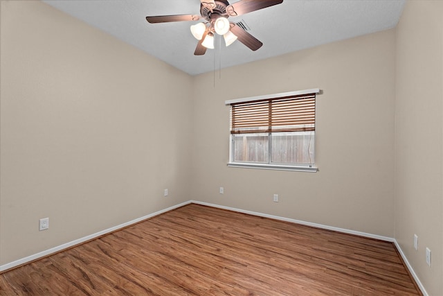 19918 Cypresswood Lake Dr, Spring, TX 77373 - unfurnished room featuring wood finished floors, a ceiling fan, and baseboards