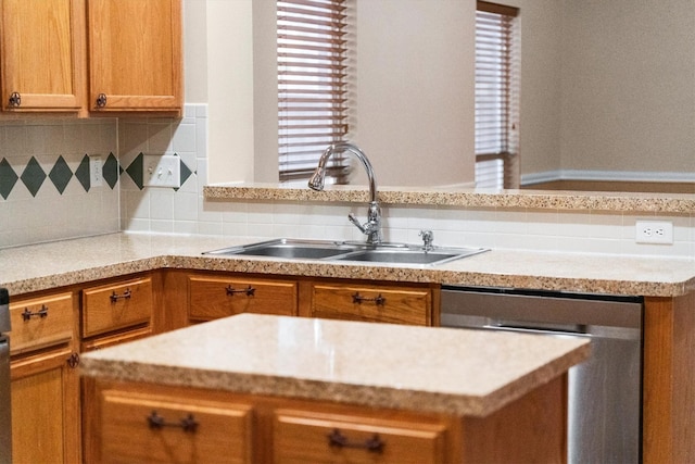 19918 Cypresswood Lake Dr, Spring, TX 77373 - kitchen featuring a sink, dishwasher, light countertops, brown cabinets, and tasteful backsplash