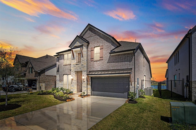 3002 Secret Lagoon Ln, Texas City, TX 77568 - french country home featuring concrete driveway, an attached garage, and brick siding