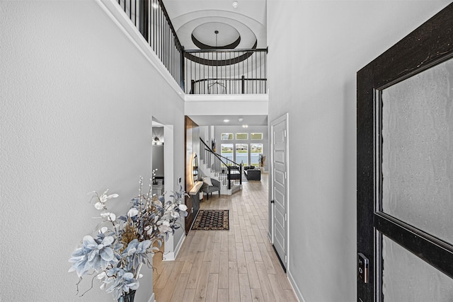 3002 Secret Lagoon Ln, Texas City, TX 77568 - foyer entrance featuring stairs, a high ceiling, light wood-style flooring, and baseboards