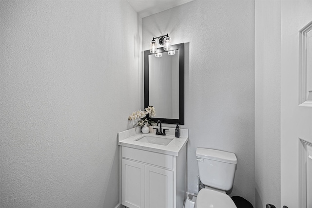 3002 Secret Lagoon Ln, Texas City, TX 77568 - half bathroom featuring vanity, toilet, and a textured wall
