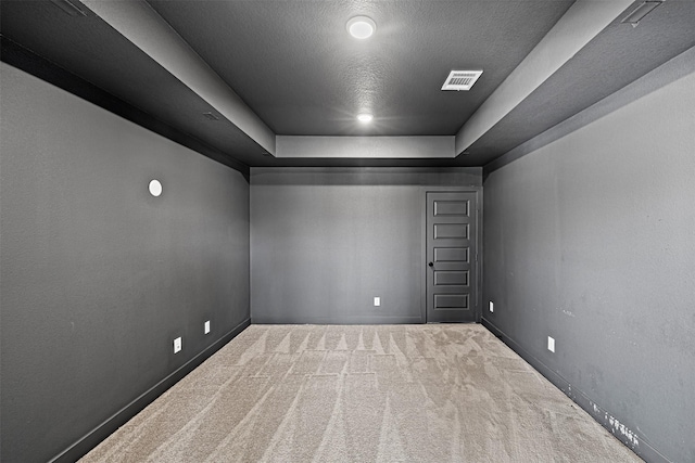 3002 Secret Lagoon Ln, Texas City, TX 77568 - unfurnished room with carpet, a raised ceiling, baseboards, and a textured ceiling