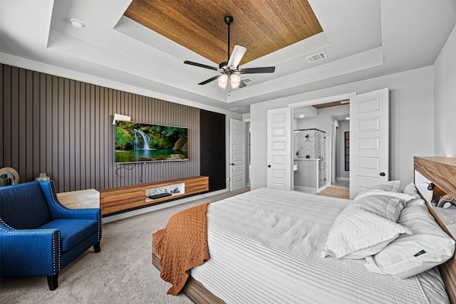 3002 Secret Lagoon Ln, Texas City, TX 77568 - bedroom with a tray ceiling, carpet, and a ceiling fan
