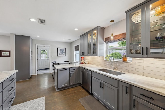 5211 Briarbend Dr, Houston, TX 77035 - kitchen featuring a sink, gray cabinets, stainless steel dishwasher, a peninsula, and tasteful backsplash