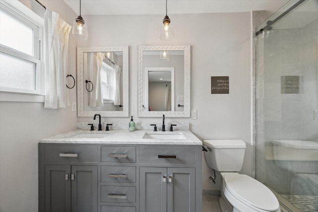 5211 Briarbend Dr, Houston, TX 77035 - bathroom with toilet, a shower stall, and double vanity
