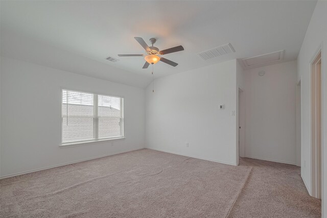 23922 Olivenza Trl, New Caney, TX 77357 - unfurnished room featuring light colored carpet, ceiling fan, and attic access