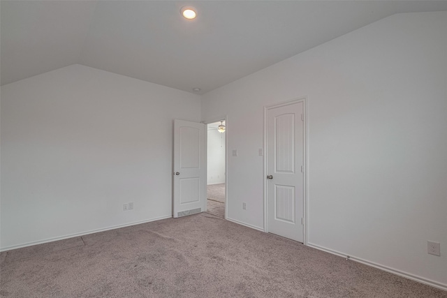 23922 Olivenza Trl, New Caney, TX 77357 - empty room featuring vaulted ceiling and carpet flooring