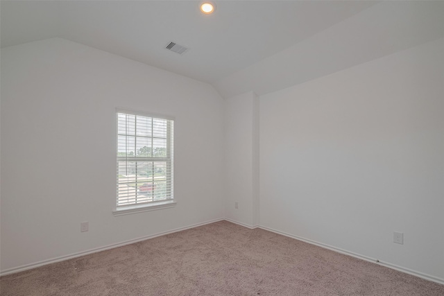 23922 Olivenza Trl, New Caney, TX 77357 - unfurnished room with vaulted ceiling, carpet, and recessed lighting
