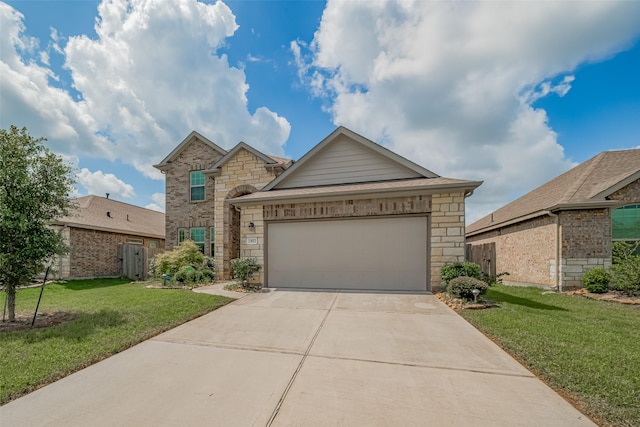 23922 Olivenza Trl, New Caney, TX 77357 - traditional home featuring driveway, stone siding, and a garage