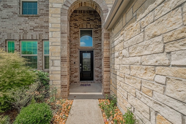 23922 Olivenza Trl, New Caney, TX 77357 - view of exterior entry with brick siding and stone siding