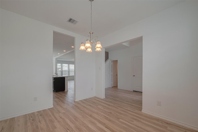 23922 Olivenza Trl, New Caney, TX 77357 - unfurnished dining area featuring a chandelier, light wood-style floors, and recessed lighting