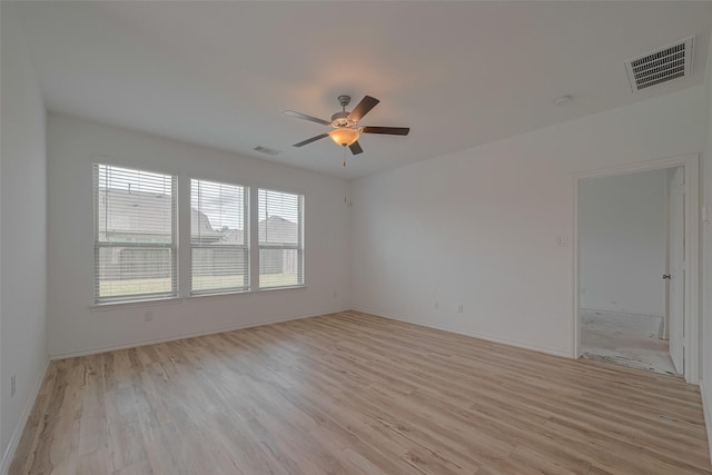 23922 Olivenza Trl, New Caney, TX 77357 - spare room with light wood-style flooring and a ceiling fan
