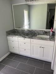 13323 S Thorntree Dr, Houston, TX 77015 - bathroom with double vanity, tile patterned flooring, and baseboards