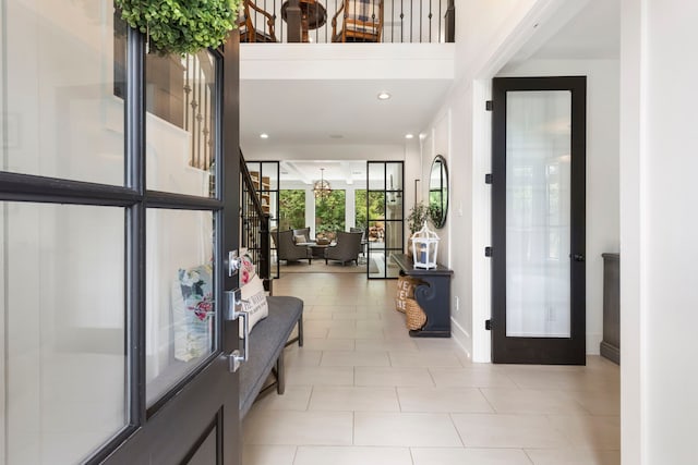 31 Wood Cove Dr, The Woodlands, TX 77381 - foyer entrance with baseboards, recessed lighting, light tile patterned flooring, and french doors