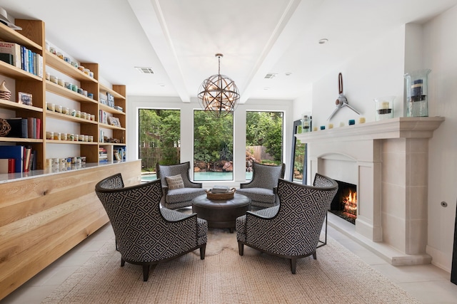 31 Wood Cove Dr, The Woodlands, TX 77381 - living area featuring plenty of natural light, tile patterned floors, a chandelier, and beam ceiling