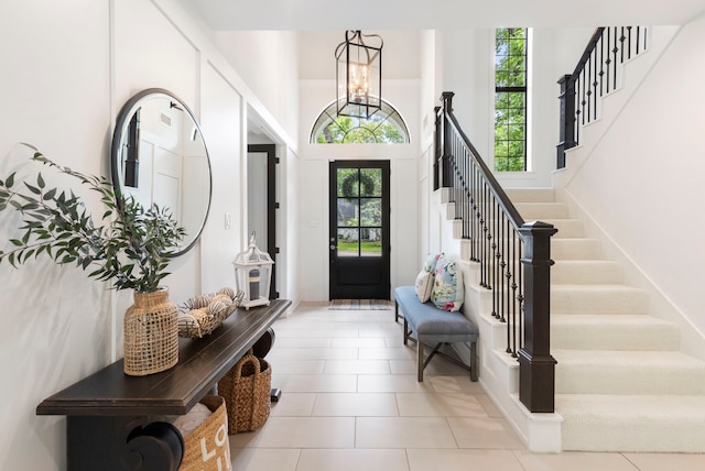 31 Wood Cove Dr, The Woodlands, TX 77381 - entrance foyer with stairway and light tile patterned floors