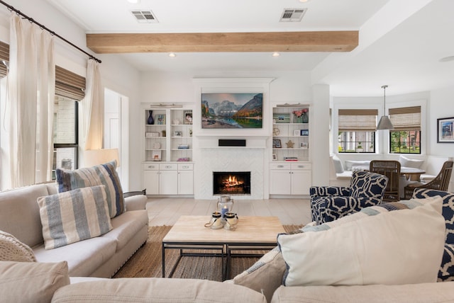 31 Wood Cove Dr, The Woodlands, TX 77381 - living area featuring a tiled fireplace, beamed ceiling, and recessed lighting