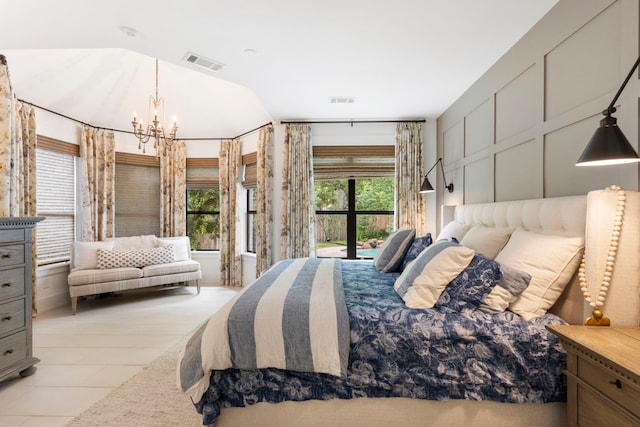 31 Wood Cove Dr, The Woodlands, TX 77381 - bedroom with a chandelier, lofted ceiling, and light tile patterned floors