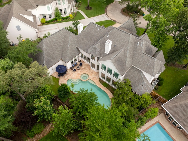 31 Wood Cove Dr, The Woodlands, TX 77381 - aerial view of property and surrounding area featuring a pool area