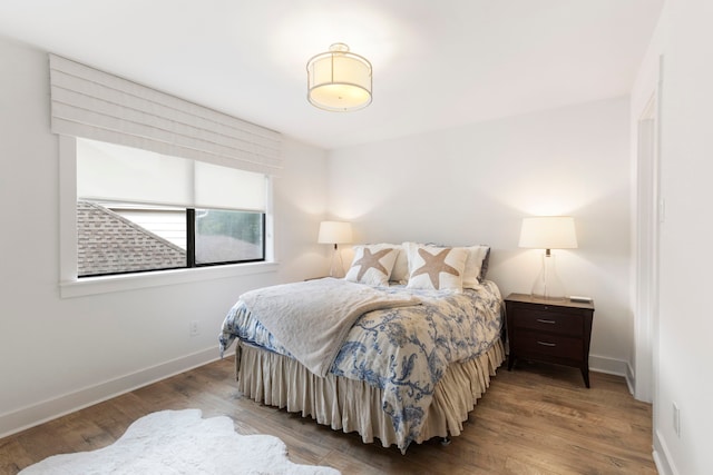 31 Wood Cove Dr, The Woodlands, TX 77381 - bedroom with wood finished floors and baseboards