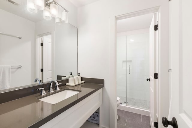 31 Wood Cove Dr, The Woodlands, TX 77381 - bathroom with toilet, a stall shower, vanity, and tile patterned flooring