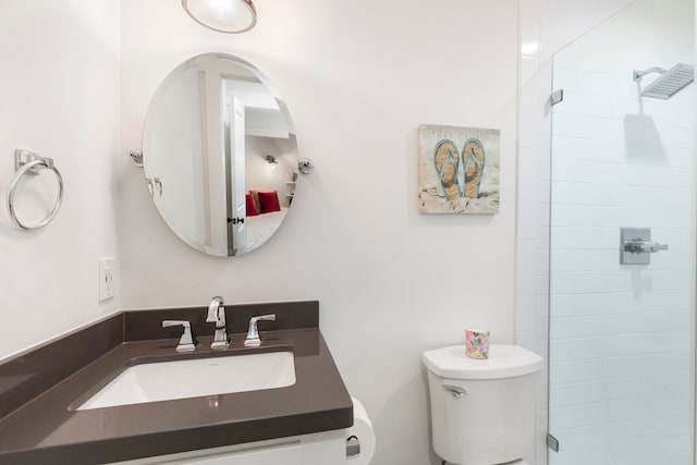 31 Wood Cove Dr, The Woodlands, TX 77381 - bathroom with a tile shower, toilet, and vanity