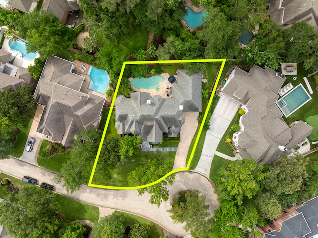 31 Wood Cove Dr, The Woodlands, TX 77381 - aerial perspective of suburban area with a pool area