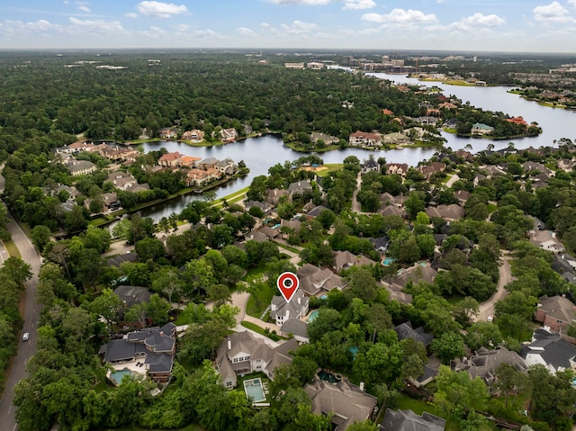 31 Wood Cove Dr, The Woodlands, TX 77381 - aerial perspective of suburban area with a large body of water and a heavily wooded area